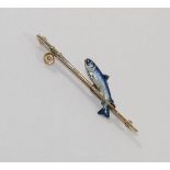An enamelled bar brooch in the form of a leaping salmon and fishing rod,