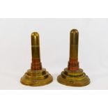 A pair of brass and copper trench art table lighters,