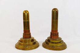 A pair of brass and copper trench art table lighters,