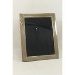 A large modern silver photograph frame, Sheffield 2002, by Carrs, photo size 20cm x 15cm,
