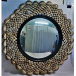 A 20th century circular convex mirror, 44cm diameter, with shell frame,