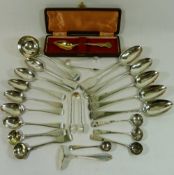 Assorted silver cutlery including a silver sauce ladle, sugar nips, salt and mustard spoons,