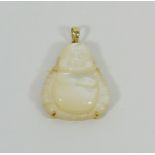 A yellow metal mounted carved mother of pearl Buddha pendant, stamped '14K', 3.