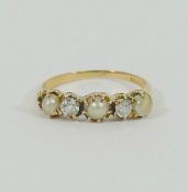 A yellow metal pearl and diamond five-stone ring, the two old cut diamonds approximately 0.