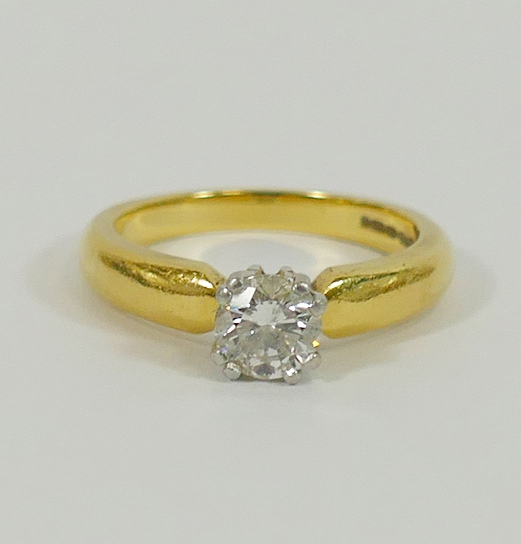 An 18 carat gold and platinum diamond single stone ring,