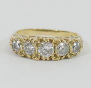 A 9 carat gold five stone cubic zirconia carved half hoop ring, finger size Q1/2, 4.