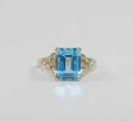 An 18 carat gold blue topaz and diamond ring,