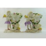 A pair of 19th century Continental porcelain figural vases,