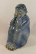 A Danish pottery blue glazed figure by L.