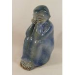 A Danish pottery blue glazed figure by L.