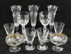Three panel cut champagne flutes, 17cm high, two small silver overlayed glass pedestal bowls,