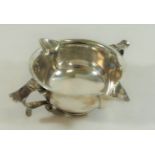 An Arts and Crafts silver two handled and double spouted porringer style bowl,