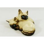 A Royal Doulton cat group of two Siamese kittens,