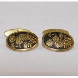 A pair of yellow metal and niello oval cufflinks, with floral decoration, stamped 'K14', 5.
