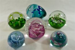 A collection of 45 paperweights including a limited edition Caithness Glass paperweight by Peter