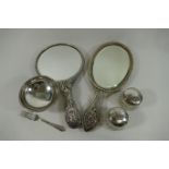 Two silver backed hand mirrors, a small silver pedestal bowl, a cake fork,