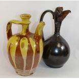 A Turkish Canakkale pottery brown glazed ewer, 32cm high,