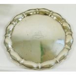 A George V silver card tray, Birmingham 1911, with wavy shaped rim and armorial engraving,