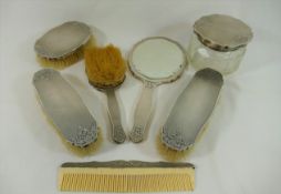 A Continental silver coloured metal backed dressing table set, stamped '.