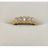 A yellow metal diamond five stone ring,