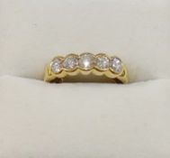 A yellow metal diamond five stone ring,