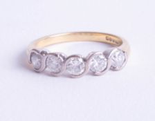 An 18ct five stone diamond ring, rub over setting, approx. 1.00ct, ring size Q.