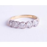 An 18ct five stone diamond ring, rub over setting, approx. 1.00ct, ring size Q.