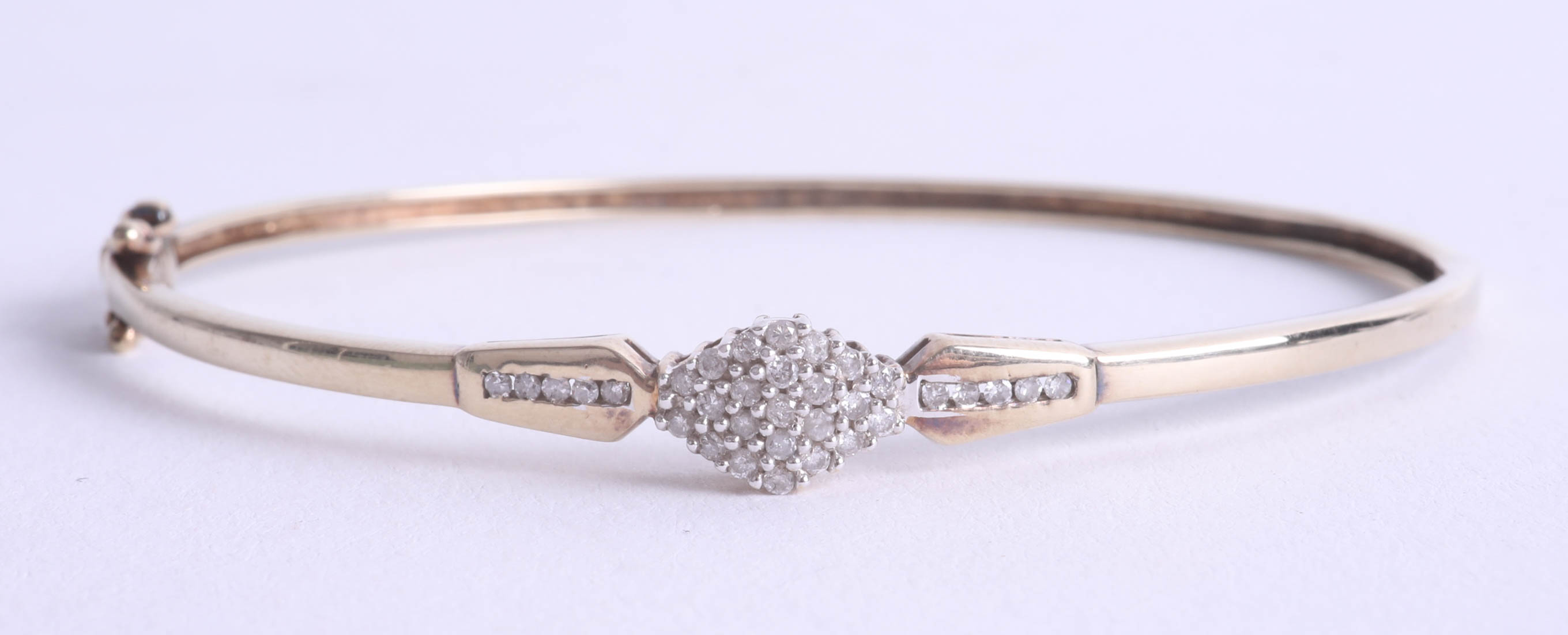 A 9ct diamond bangle.