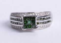 An 10k white gold green diamond ring, size N.