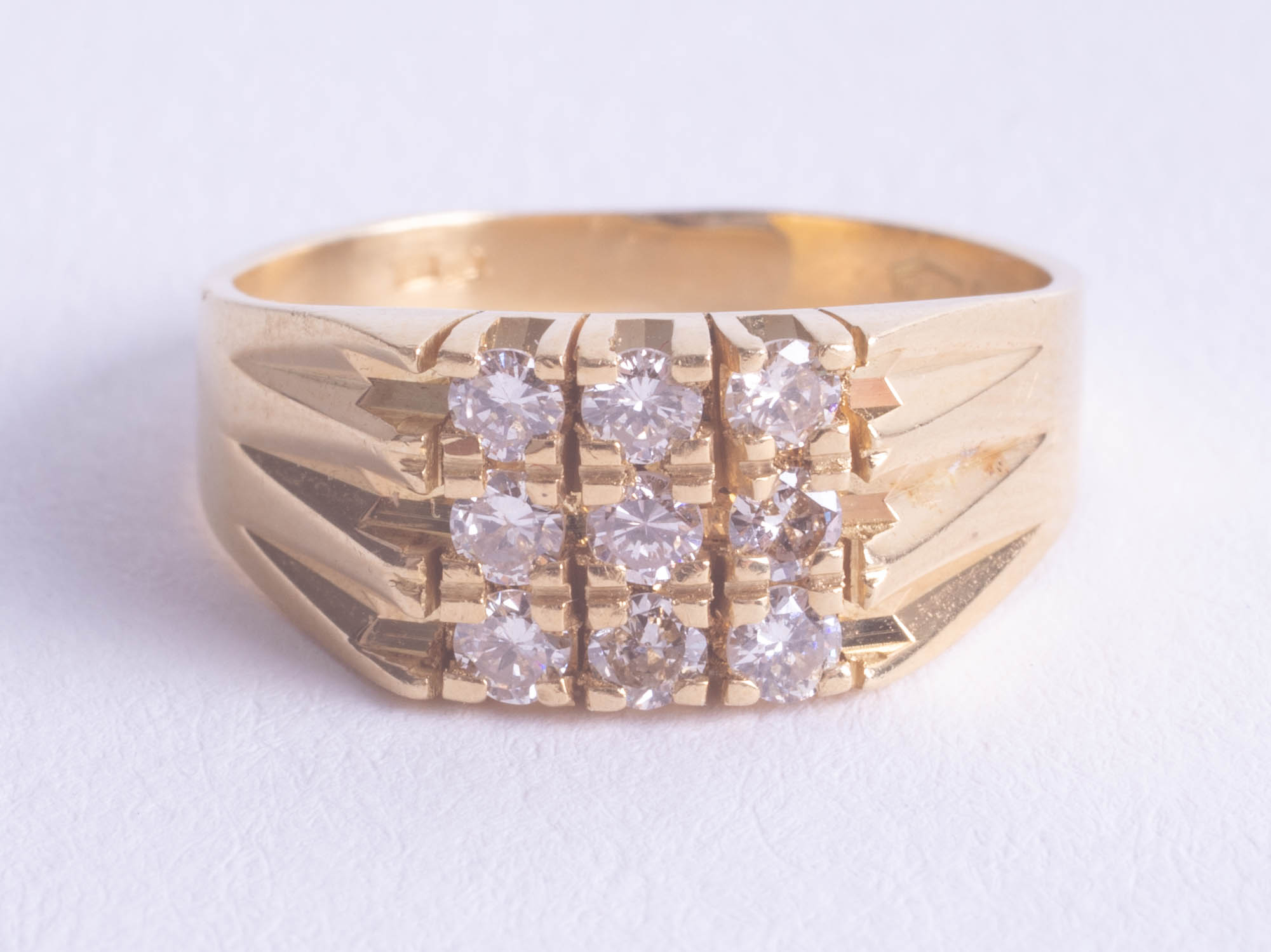 An 18ct nine stone diamond ring, size M.