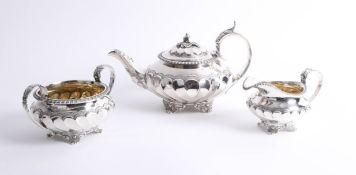 A Will IV three piece silver tea service of squat design with fluted body, teapot hallmarked circa