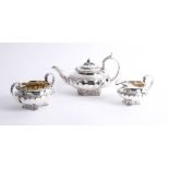 A Will IV three piece silver tea service of squat design with fluted body, teapot hallmarked circa
