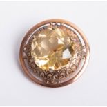 An antique gold brooch set with a large citrine indistinct marks, diameter 37mm.