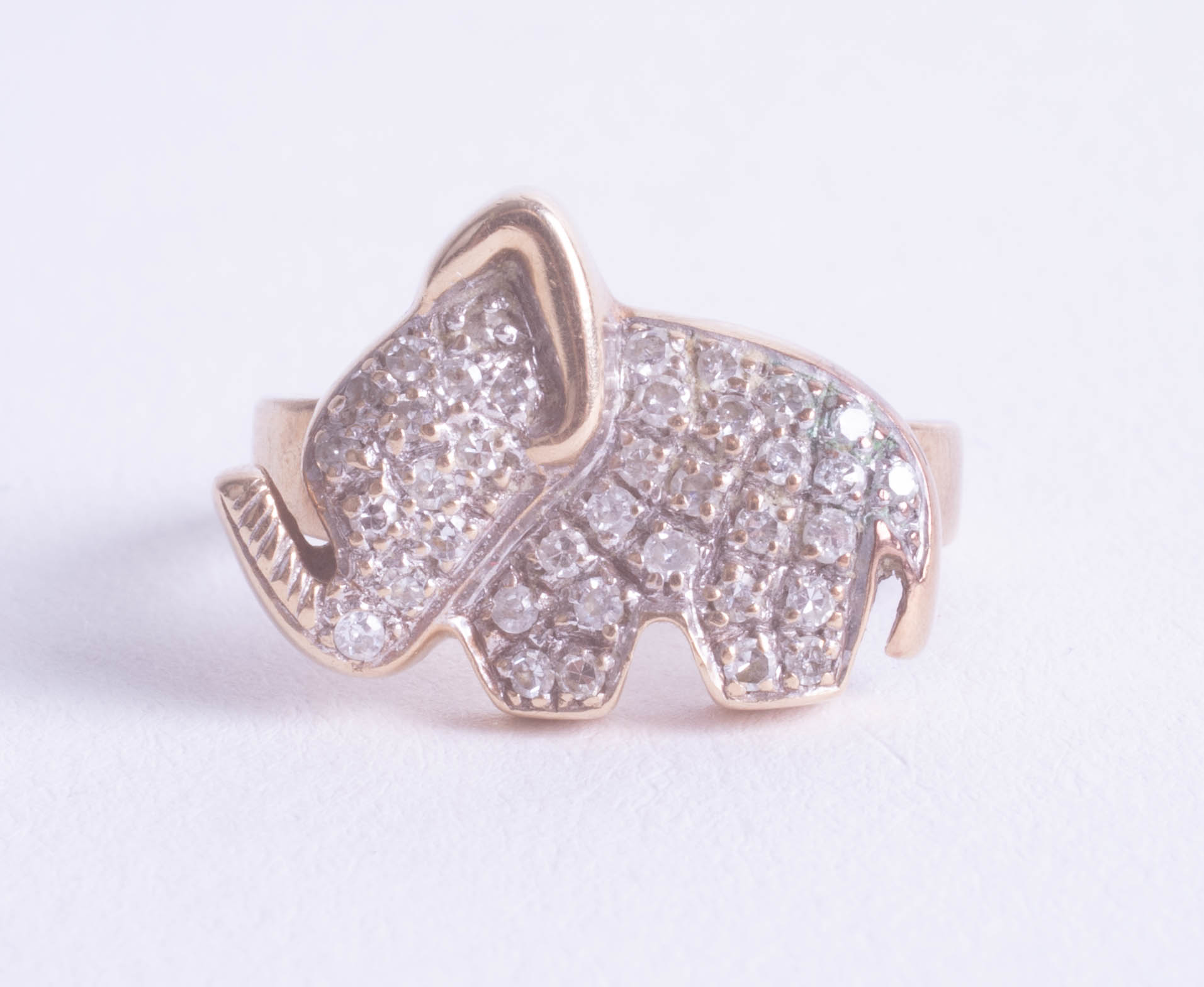 An unusual diamond set elephant ring, size L.