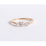 An 18ct gold and diamond trilogy ring approx. 0.50ct, size M.