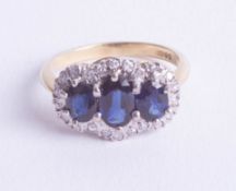 An 18ct sapphire and diamond set cluster ring, ring size M.