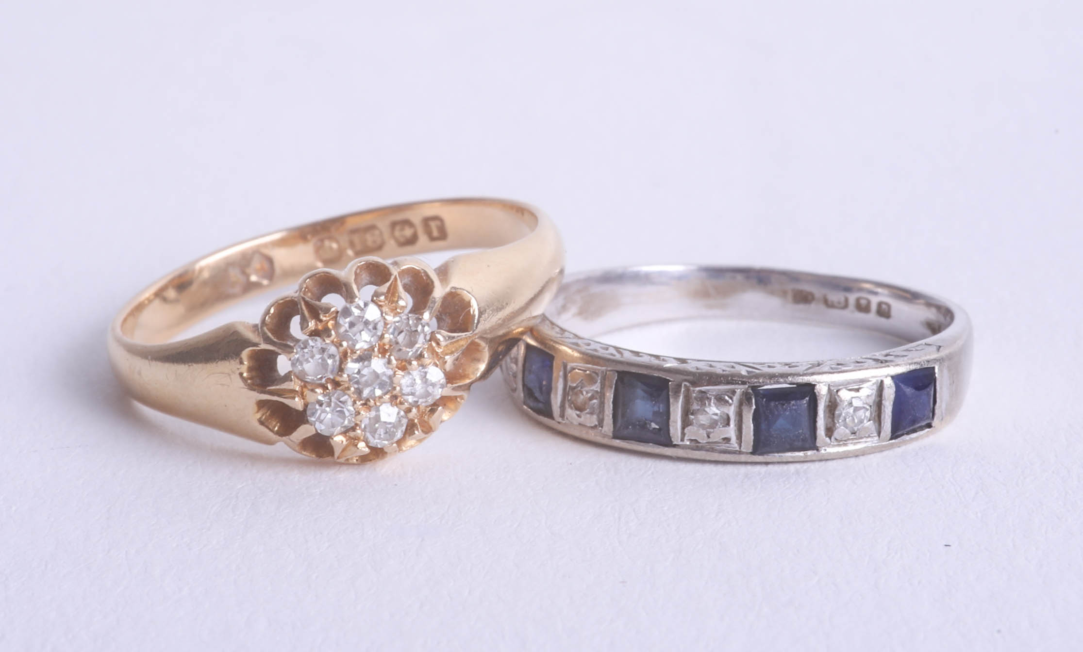 Two 18ct and diamond set dress rings.