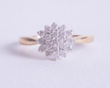 An 18ct diamond cluster' ring size O.