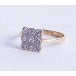 An 18ct antique nine stone diamond ring of square design, size L.
