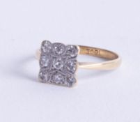 An 18ct antique nine stone diamond ring of square design, size L.