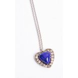 A pendant of heart design set with blue hardstone and diamonds, Provenance, from the family of