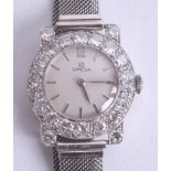 Omega, a fine ladies platinum cocktail wristwatch, the dial set with a band of diamonds approx. 4ct,