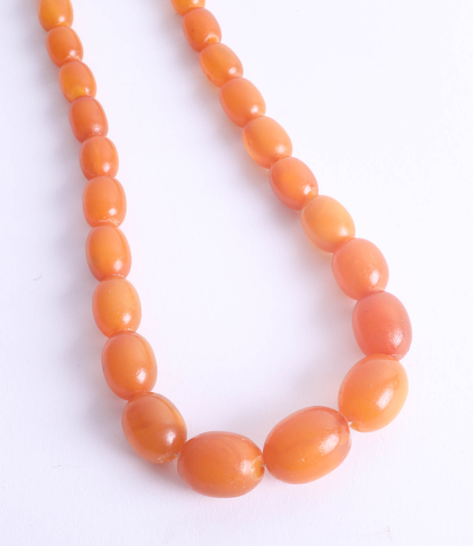 A yellow amber bead necklace, 35.5g. - Image 2 of 2