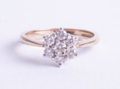 A 9ct diamond cluster ring, size N.