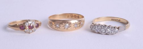 Three various 18ct and diamond set dress rings.