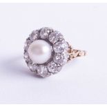 An 18ct Victorian diamond and Southsea pearl ring, measuring approx. 8.2mm in diameter, set as a