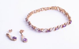 A 9ct amethyst and diamond bracelet together with a pair of matching earrings.