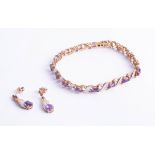 A 9ct amethyst and diamond bracelet together with a pair of matching earrings.