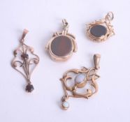 Two Art Nouveau style pendants and two gold fobs.