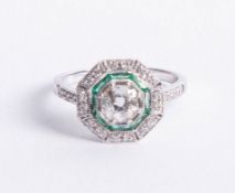 An 18ct diamond and emerald Art Deco style ring, set in white gold, the diamonds are approx